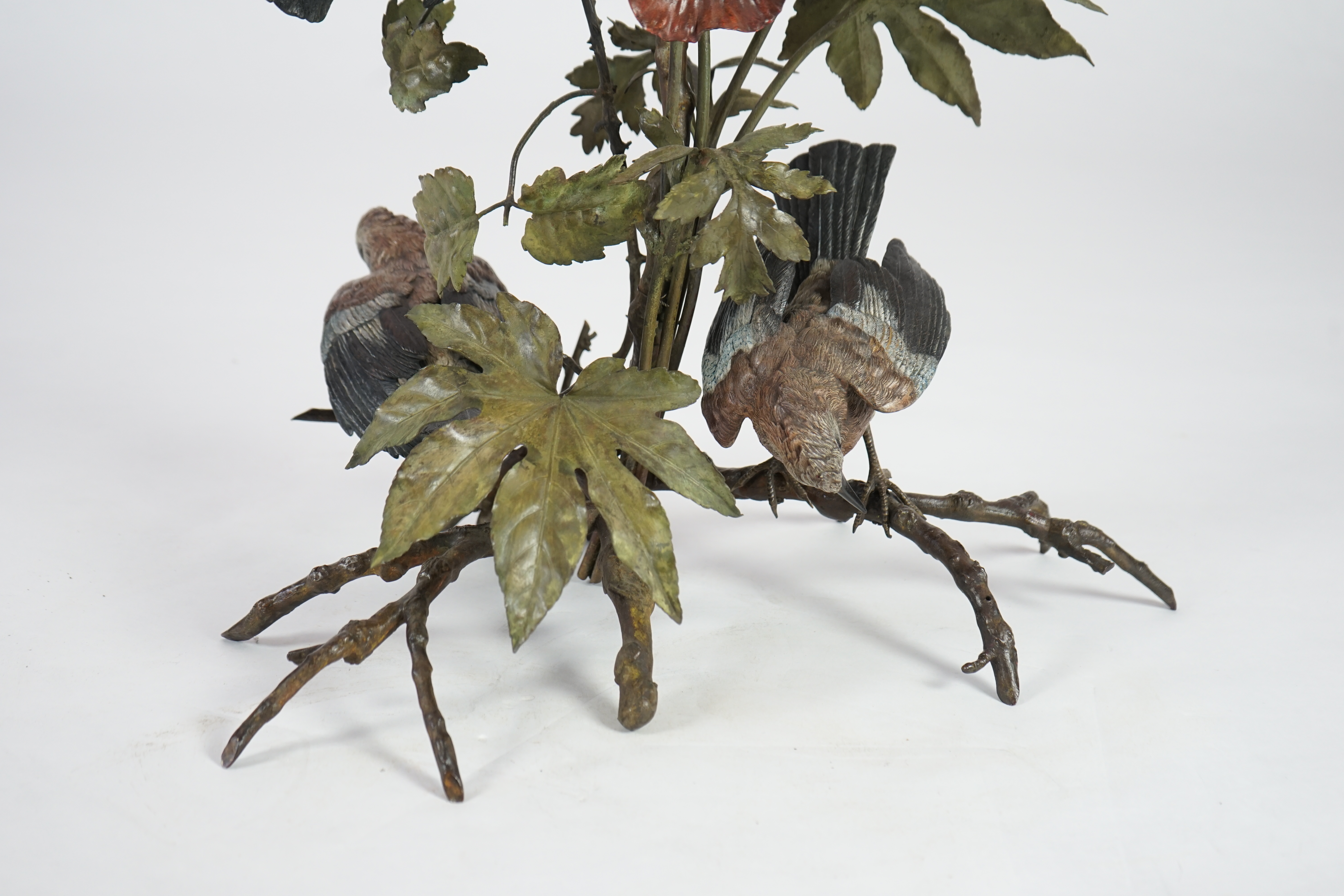 An impressive late 19th century Austrian cold painted bronze group of three jays perched amongst branches